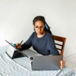 woman working on laptop and tablet