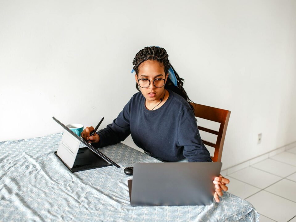 woman working on laptop and tablet